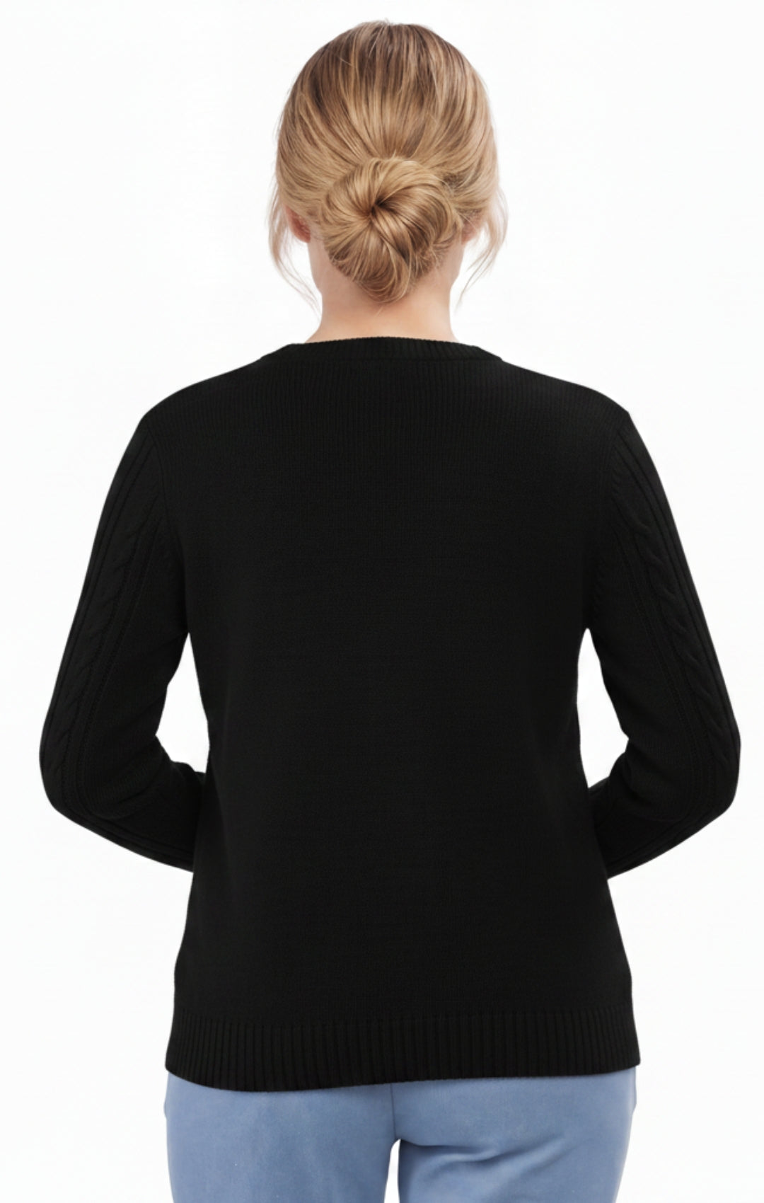 Person wearing a black sweater on a white background